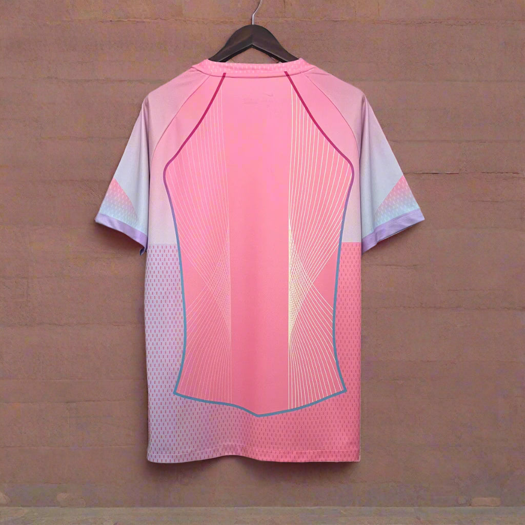 Pink and light purple sports outfit on a hanger against a geometric black and white background