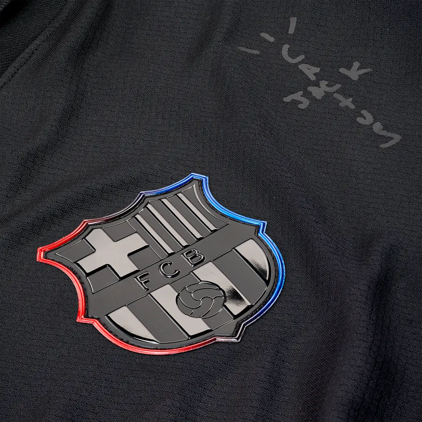 Black jersey with a prominent FC Barcelona logo on the chest.