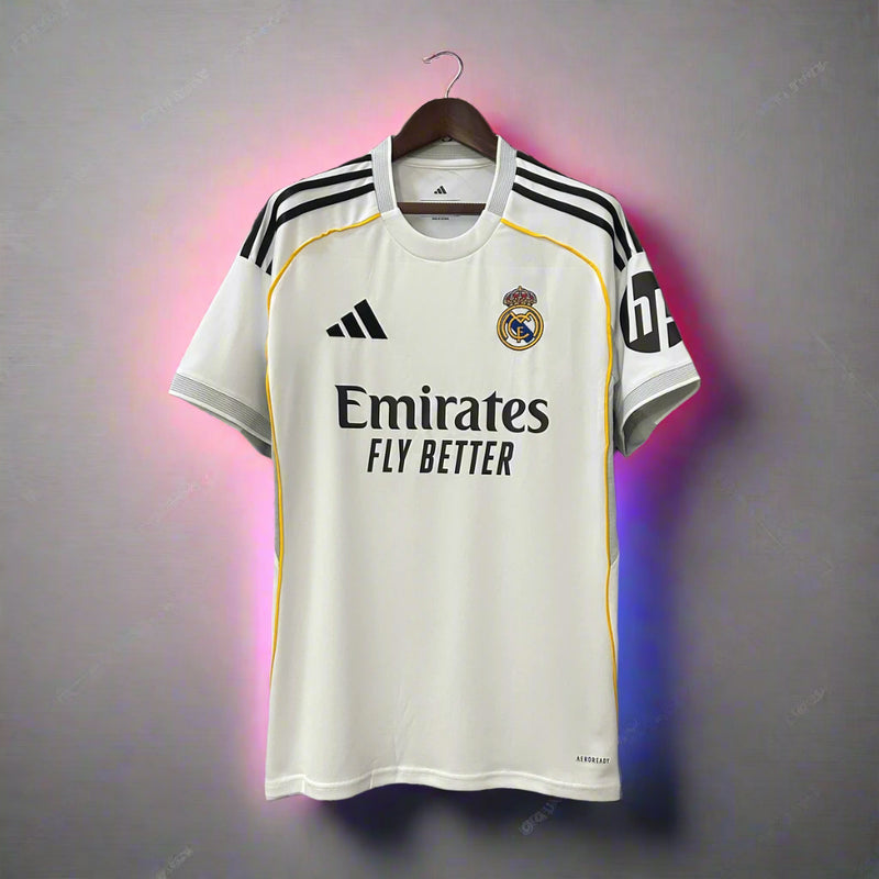 White sports jersey with black and yellow accents on a hanger against a gray background
